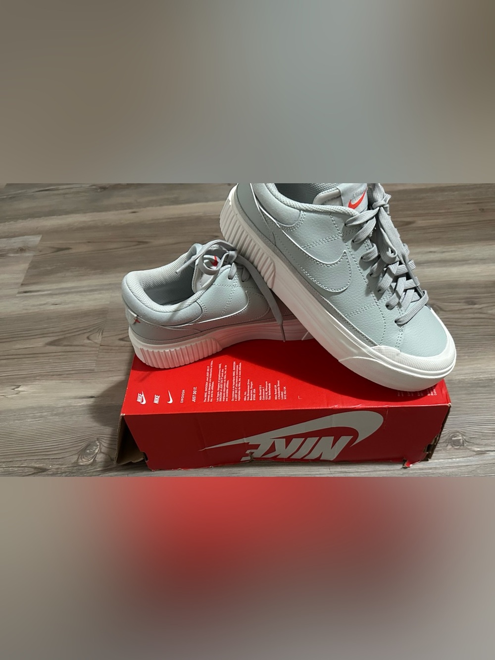 Nike Women's Light Gray Sneakers with White Sole and Small Red Swoosh